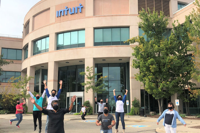 Intuit employees in front of the building