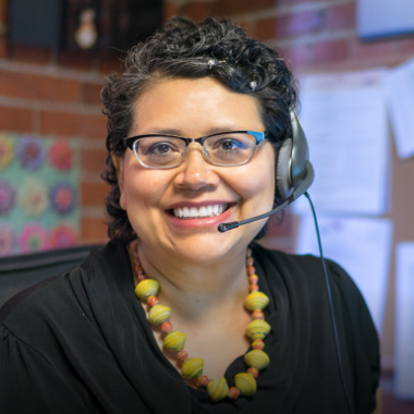 Intuit Expert wearing an headset and smiling 